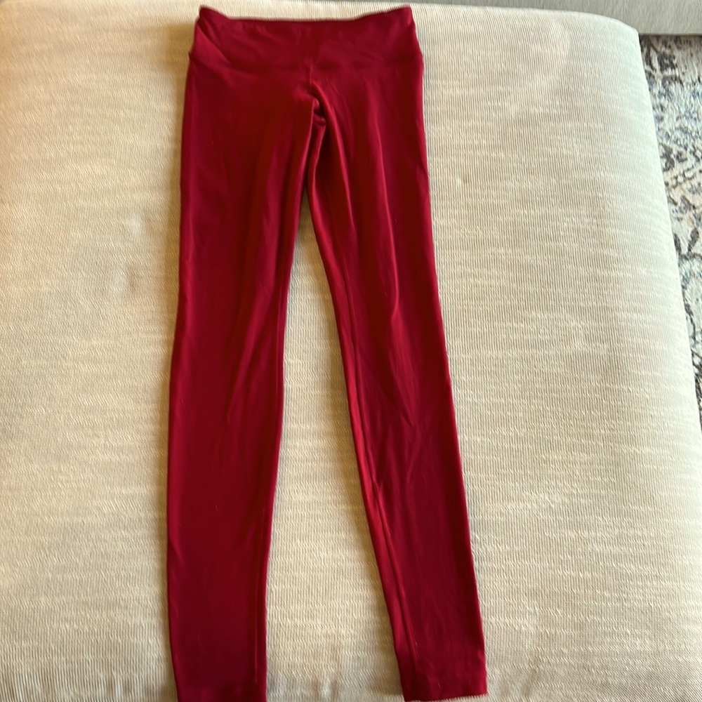 Wonder under dark red leggings